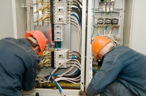 Ajax electricians fixing industrial circuit lines