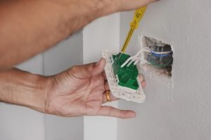 Ajax electrician repairing a plug