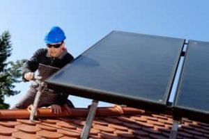 Ajax Electrical worker installing solar panels